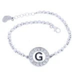 Bracciale cerchio con lettera smaltata e zirconi